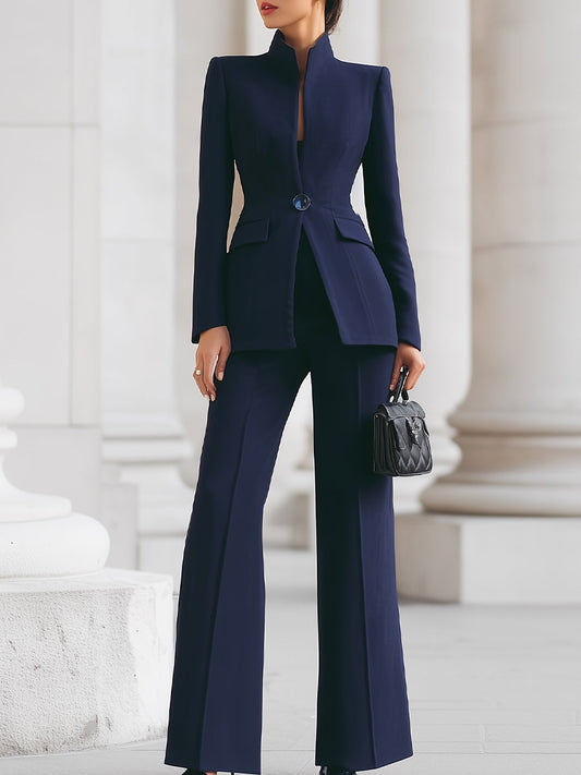 Sleek women's suit featuring a tailored blazer and elongated trousers, perfect for professional and formal occasions. 0
