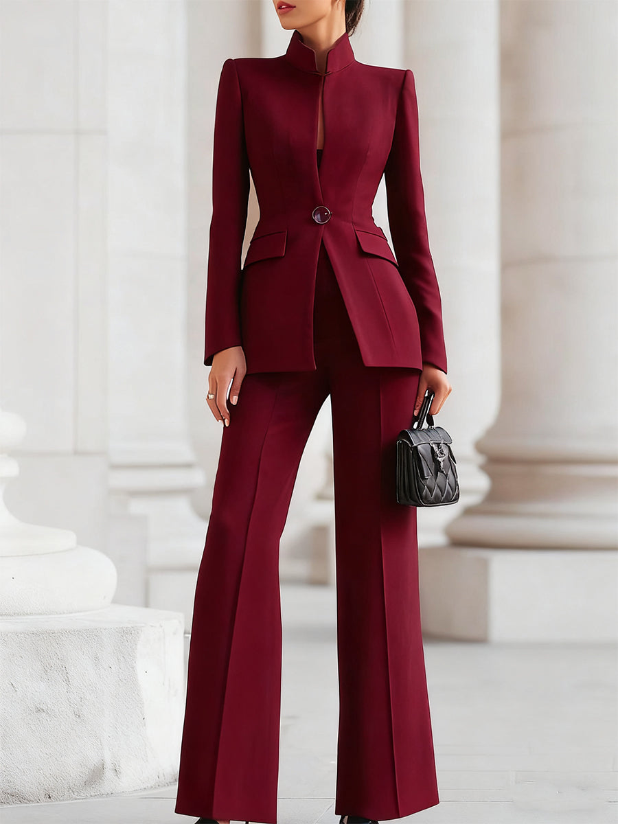 Sleek women's suit featuring a tailored blazer and elongated trousers, perfect for professional and formal occasions. 3