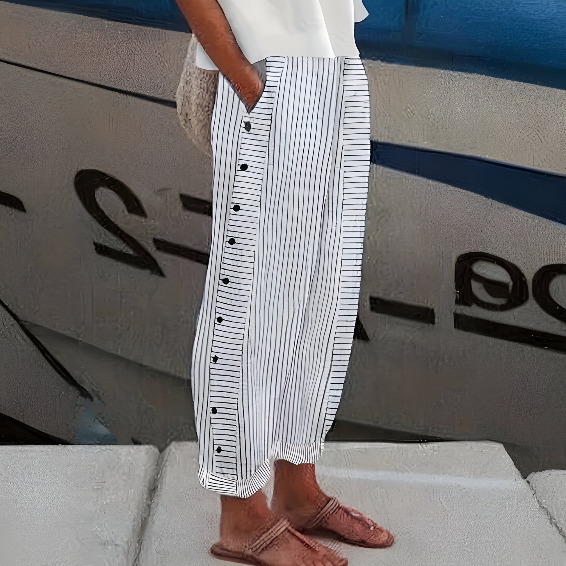 Sleek women’s trousers featuring stylish stripe panel detail and a chic cropped length, perfect for modern casual or office wear. 2