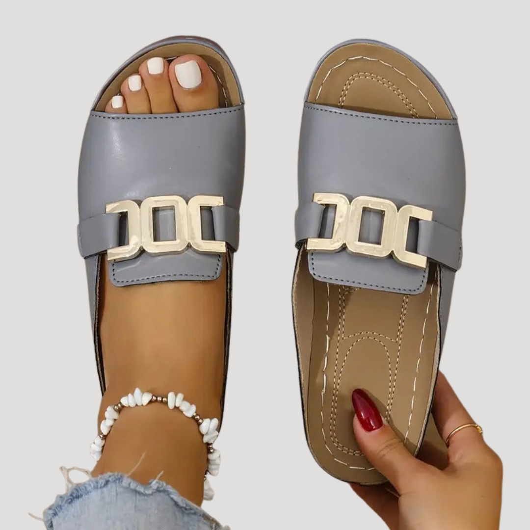Soleil Women’s Slide Sandals featuring a stylish statement metallic buckle, perfect for summer outings and casual wear. 7