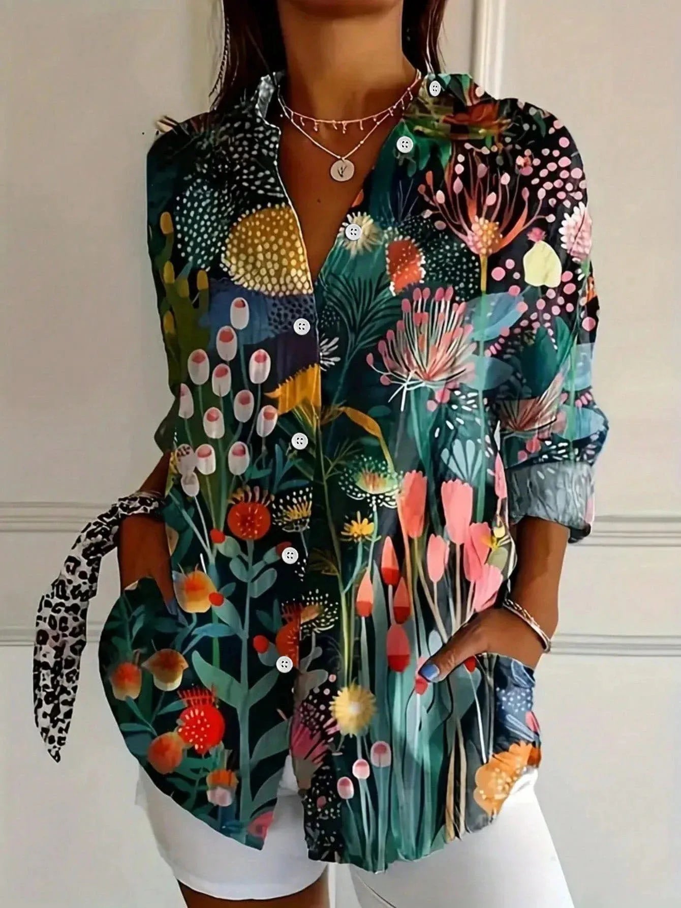Tara Women’s Blouse featuring a vibrant colorful print and lightweight airy fit, perfect for stylish summer wear. 2