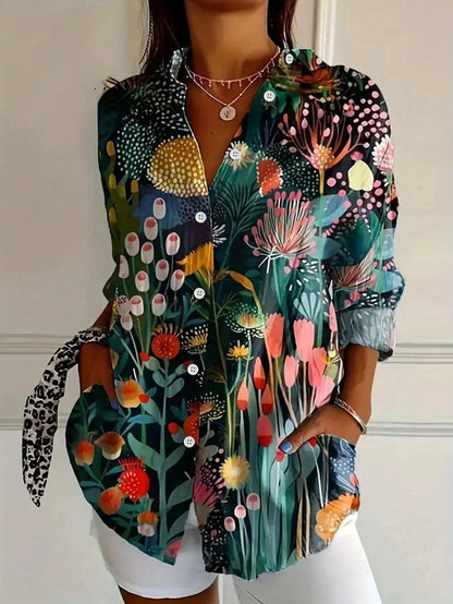 Tara Women’s Blouse featuring a vibrant colorful print and lightweight airy fit, perfect for stylish summer wear. 2