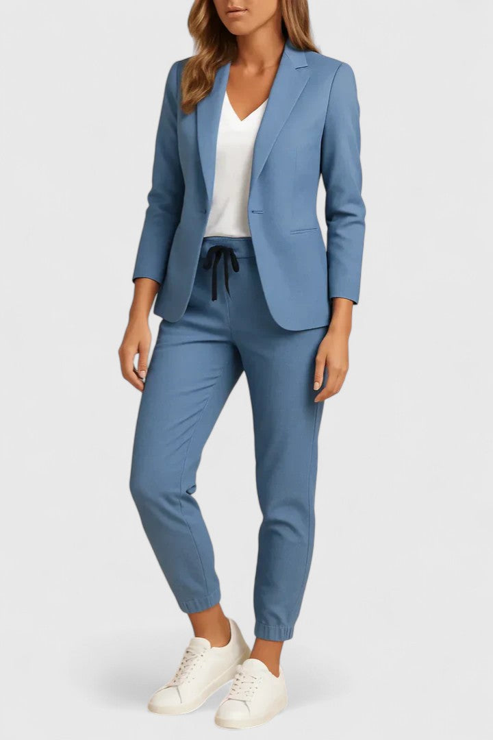 Elegant Trisha women's suit featuring a tailored jacket and matching pants, perfect for professional and formal occasions. 0