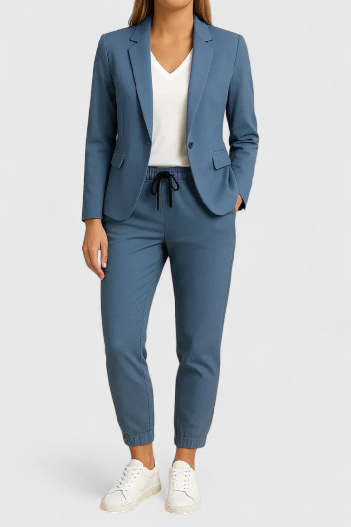 Elegant Trisha women's suit featuring a tailored jacket and matching pants, perfect for professional and formal occasions. 1