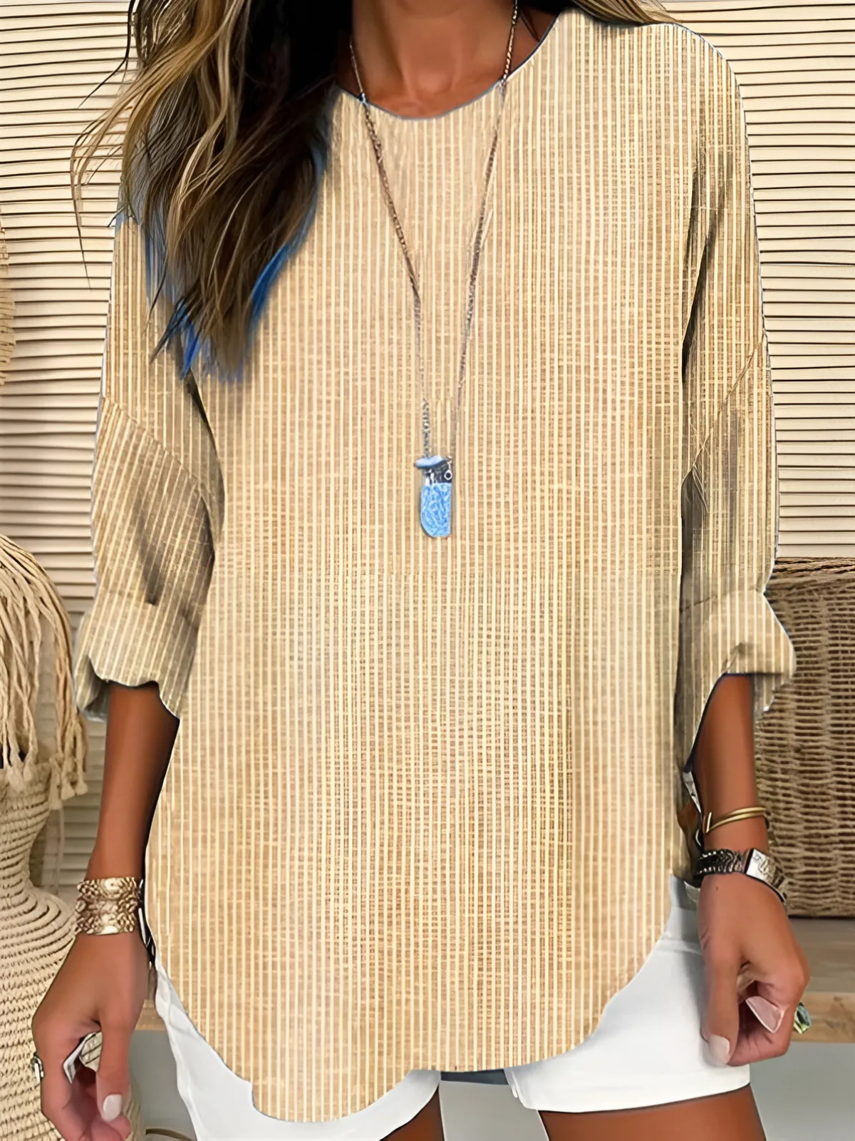 Vera women's blouse featuring vertical stripes and long sleeves, perfect for a stylish and comfortable look. 1
