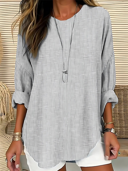 Vera women's blouse featuring vertical stripes and long sleeves, perfect for a stylish and comfortable look. 2