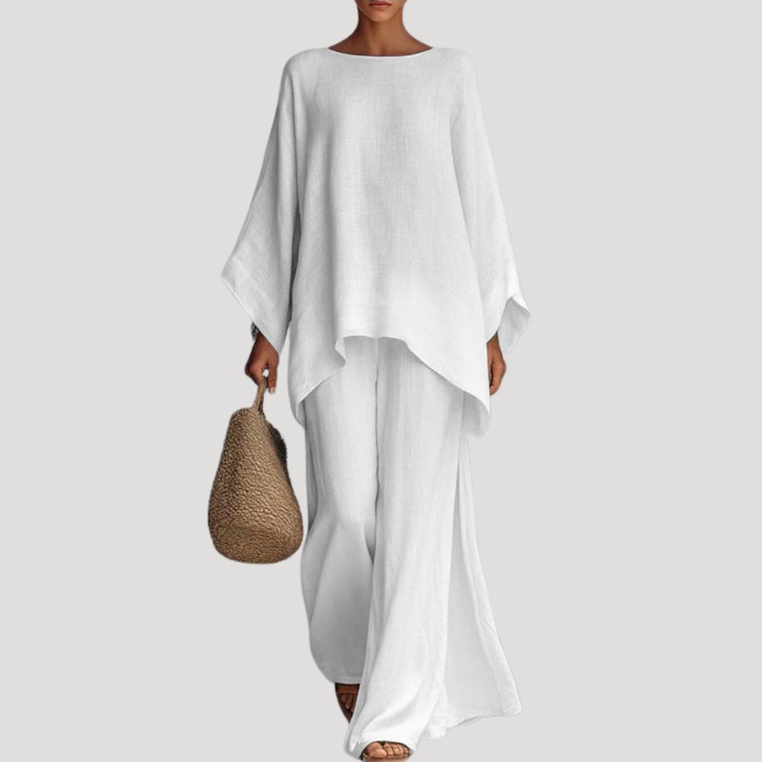 Wavy women’s co-ord set featuring a stylish relaxed cape style top and wide leg trousers, perfect for casual outings and comfortable wear. 0