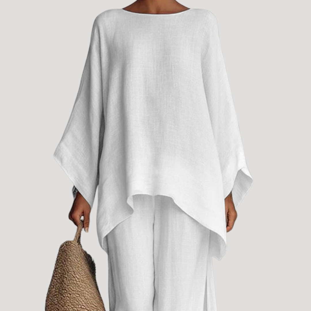 Wavy women’s co-ord set featuring a stylish relaxed cape style top and wide leg trousers, perfect for casual outings and comfortable wear. 1
