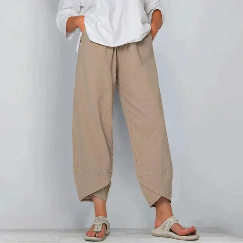 Wavy women’s pants featuring a wide leg cut and stylish angled hem detail, perfect for a chic and comfortable look. 0