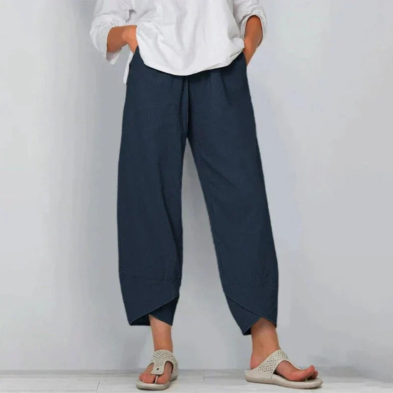 Wavy women’s pants featuring a wide leg cut and stylish angled hem detail, perfect for a chic and comfortable look. 1