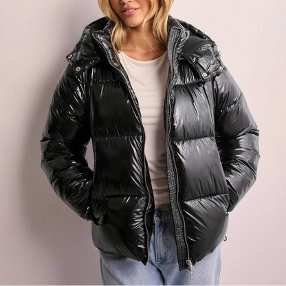Wynna Women's Quilted Puffer Coat featuring lightweight insulation and a stylish hood, perfect for staying warm and fashionable during winter outings. 0