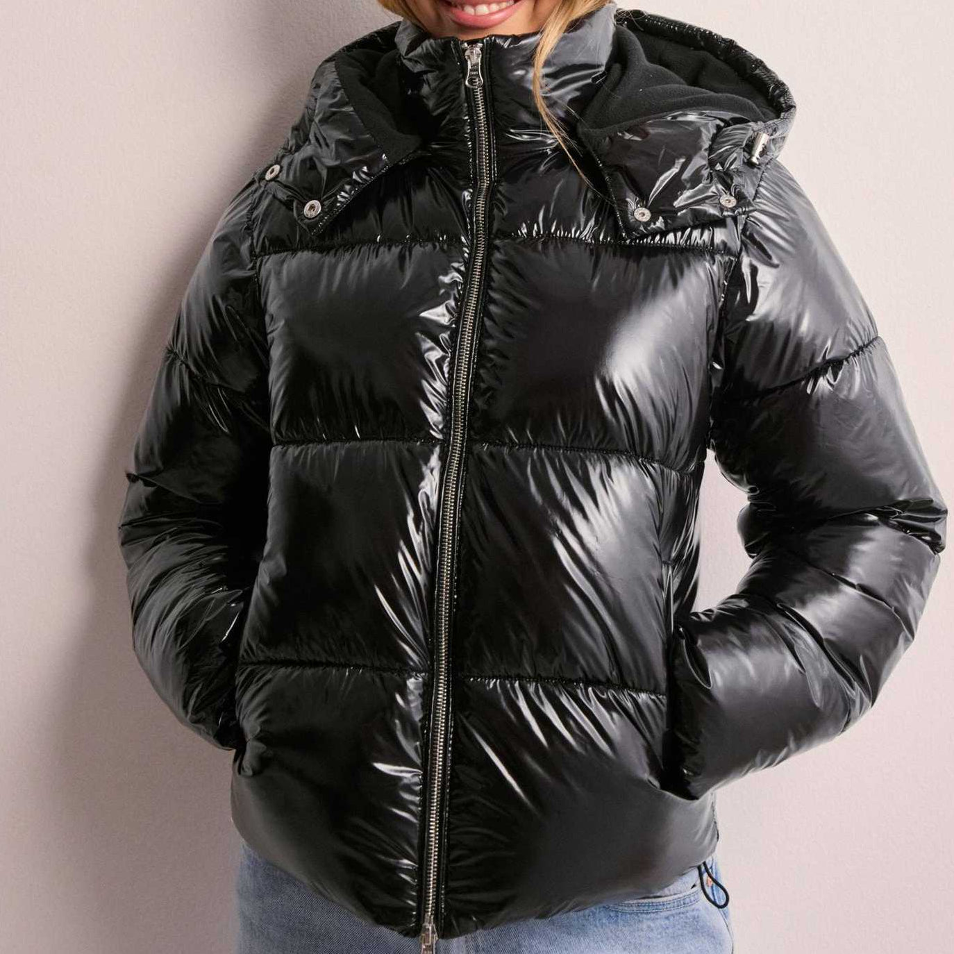 Wynna Women's Quilted Puffer Coat featuring lightweight insulation and a stylish hood, perfect for staying warm and fashionable during winter outings. 1