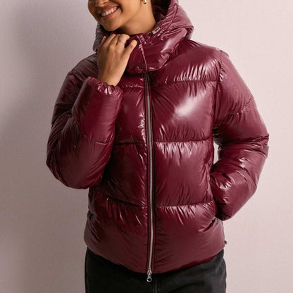Wynna Women's Quilted Puffer Coat featuring lightweight insulation and a stylish hood, perfect for staying warm and fashionable during winter outings. 2