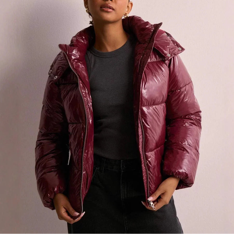 Wynna Women's Quilted Puffer Coat featuring lightweight insulation and a stylish hood, perfect for staying warm and fashionable during winter outings. 3
