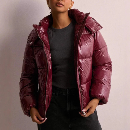 Wynna Women's Quilted Puffer Coat featuring lightweight insulation and a stylish hood, perfect for staying warm and fashionable during winter outings. 3