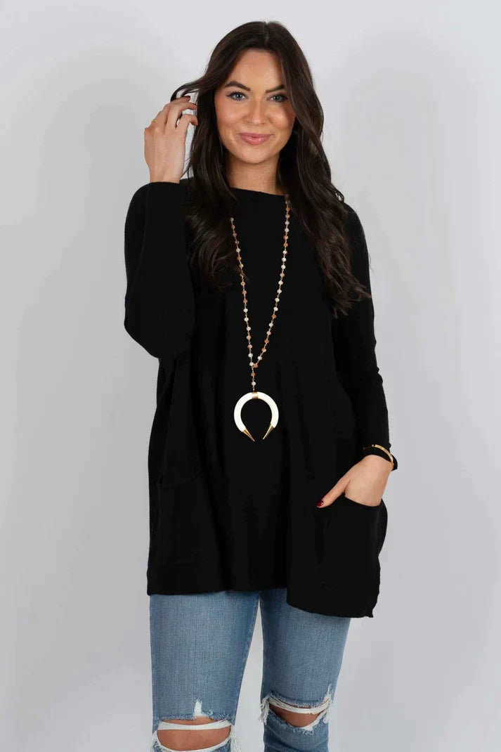 Zara women’s oversized sweater in warm autumn colors, featuring a cozy design perfect for fall fashion. 16